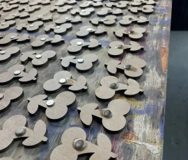 magnets being glued to the backs of custom wood magnets