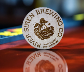 promote your bar with wood nickels